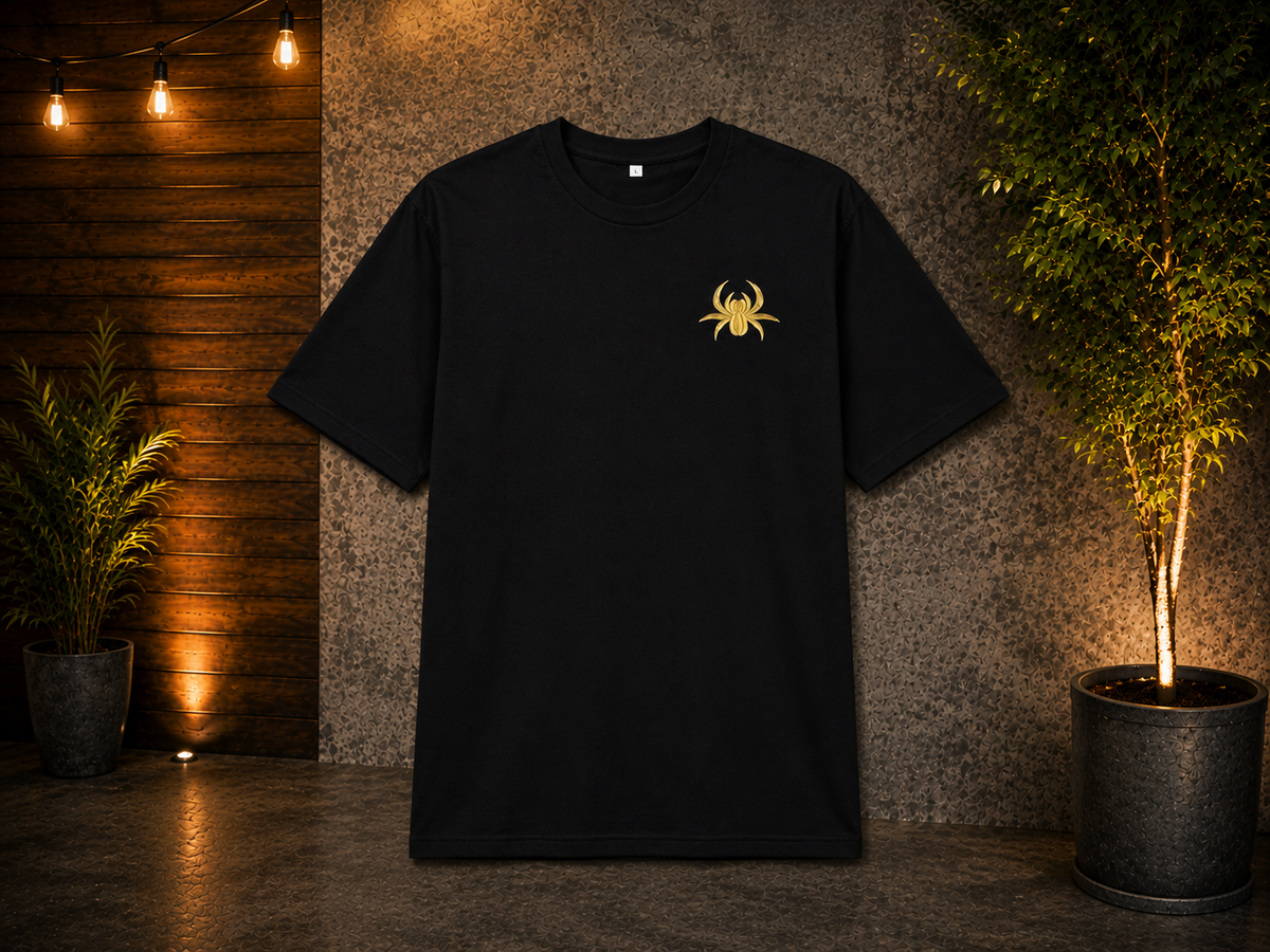 Black SilkNook T-shirt featuring a gold spider logo on the front, displayed